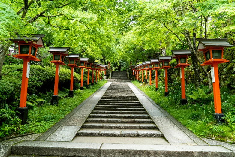 the pathway has seven red lanterns, and steps lead down to it