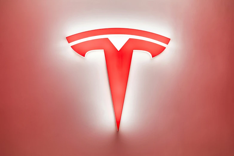 tesla logo on the side of a car