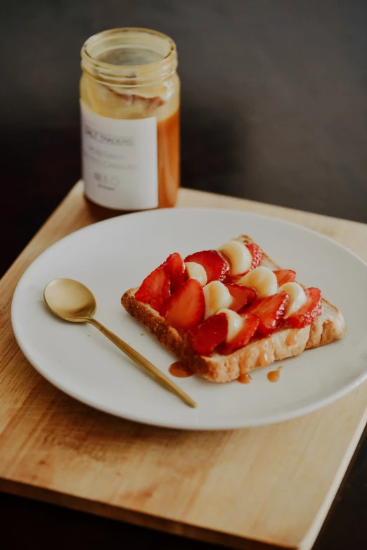 a plate with a spoon and food on it