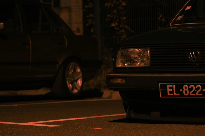 a car sits parked in the dark by itself