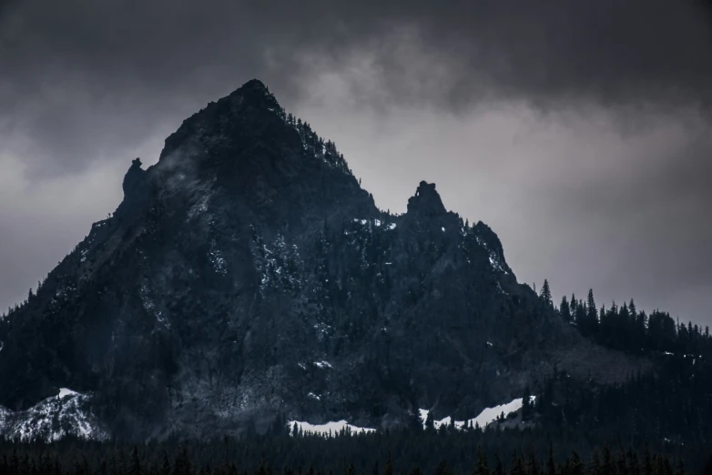 a mountain that has some snow on it