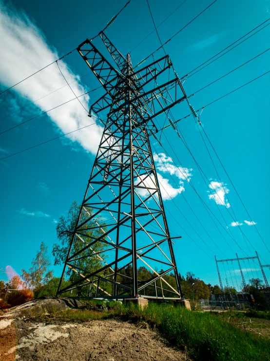 a power line with wires above the ground