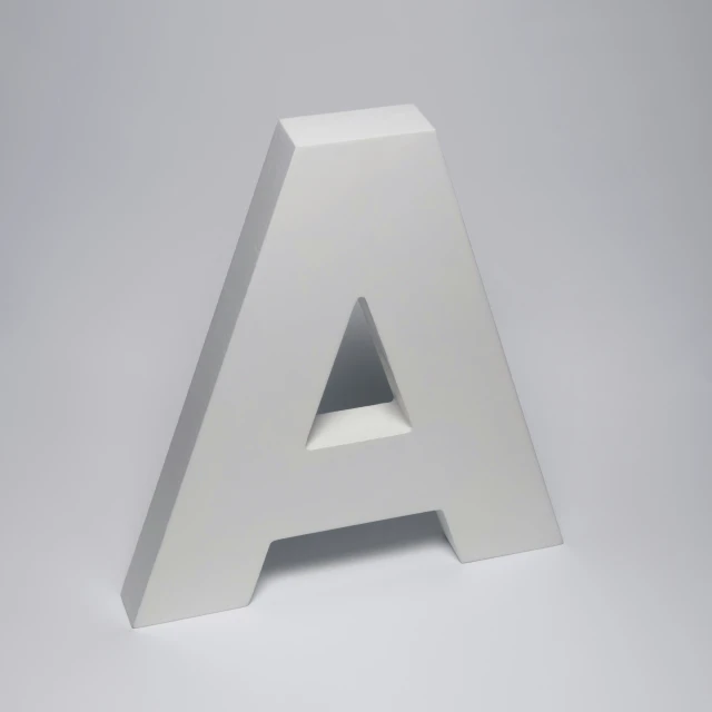 a big white letter sitting on top of a floor