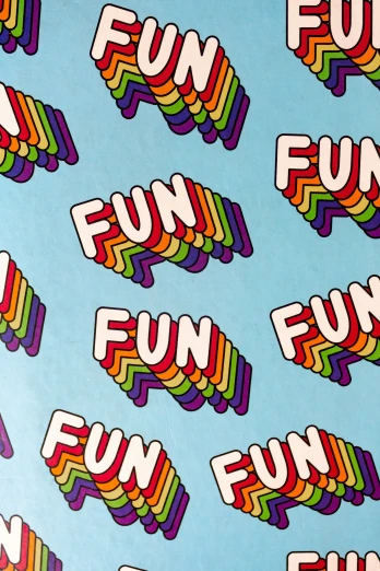 several colorful stickers that spell fun in different languages