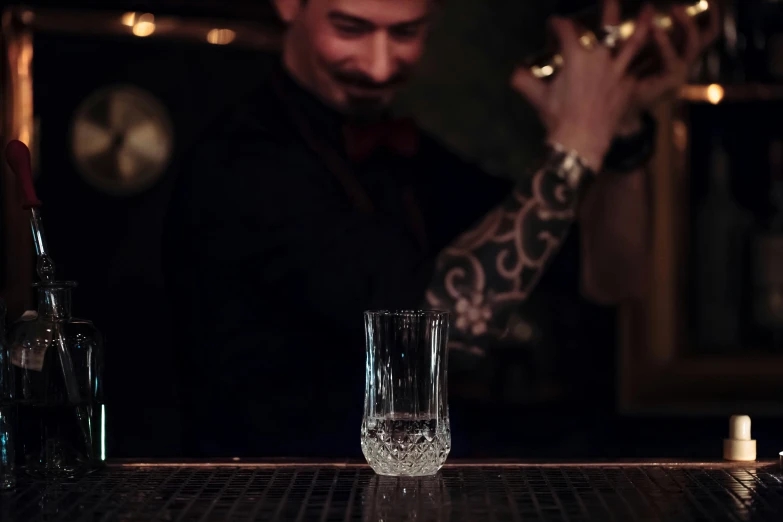 a man with his hand on the glass