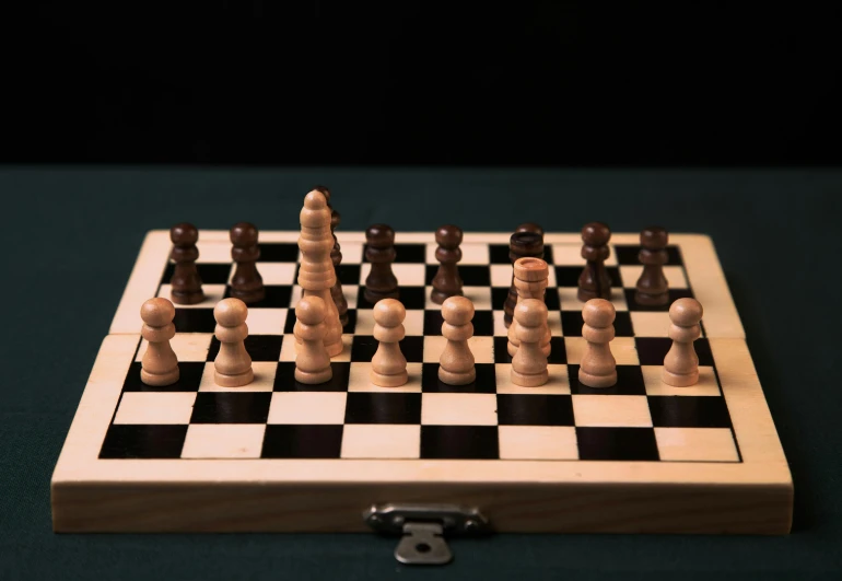 a chess board with several pieces on top