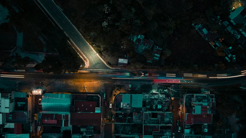 a street intersection with several cars on the road