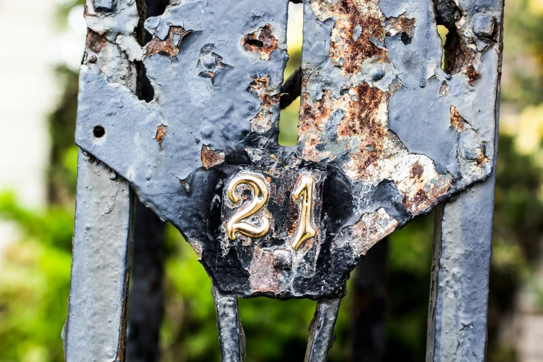 a close up picture of a sign on a metal pole