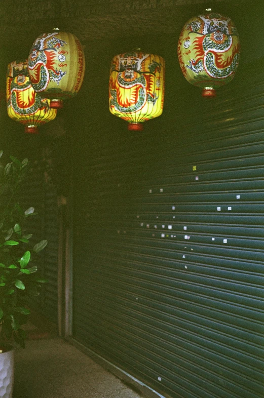 a doorway at a restaurant with three colorful lights above it