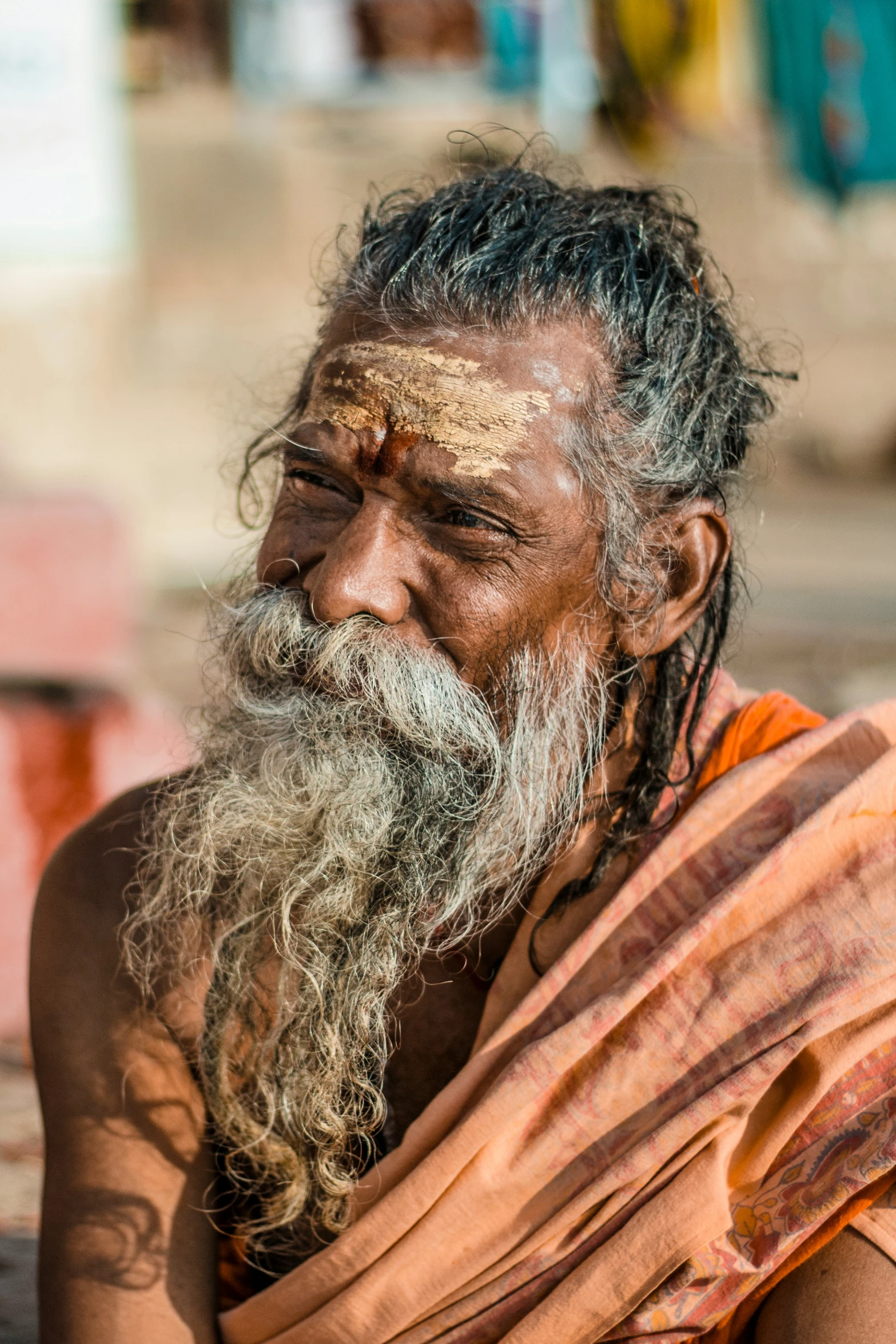 an old indian man with white hair and beard