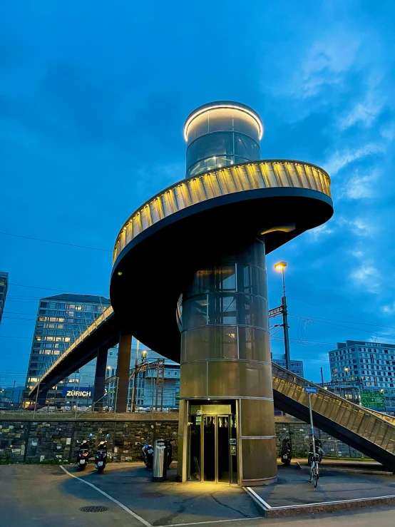 a large building with a big spiral shaped structure on it