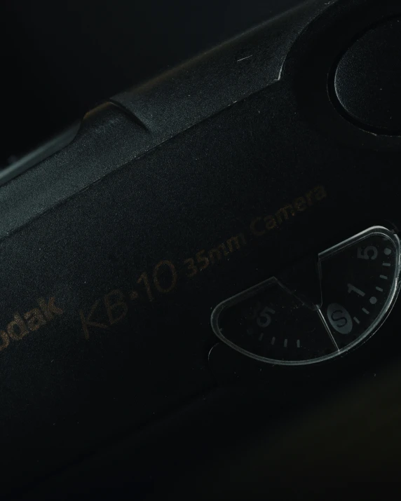a close up view of the dial of a black camera