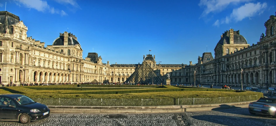 a big building with some cars in front of it