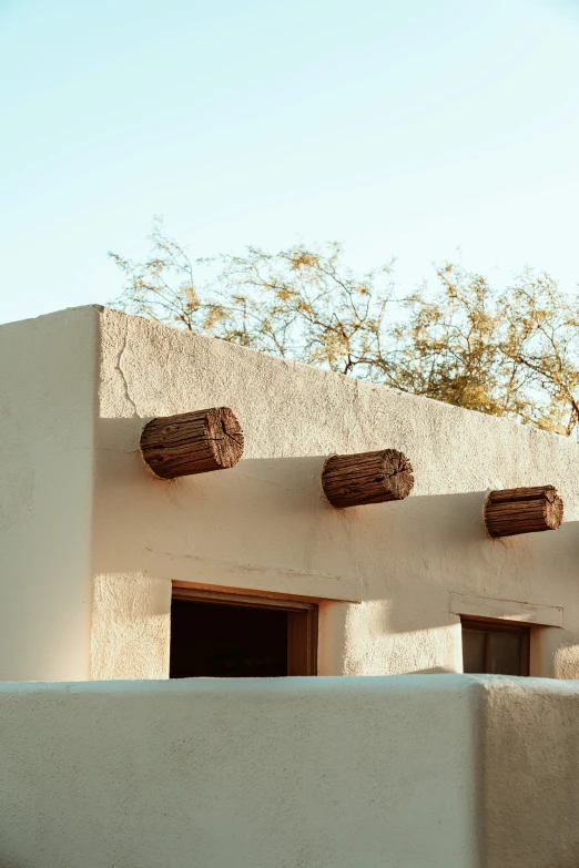 the building has five wooden pots on it