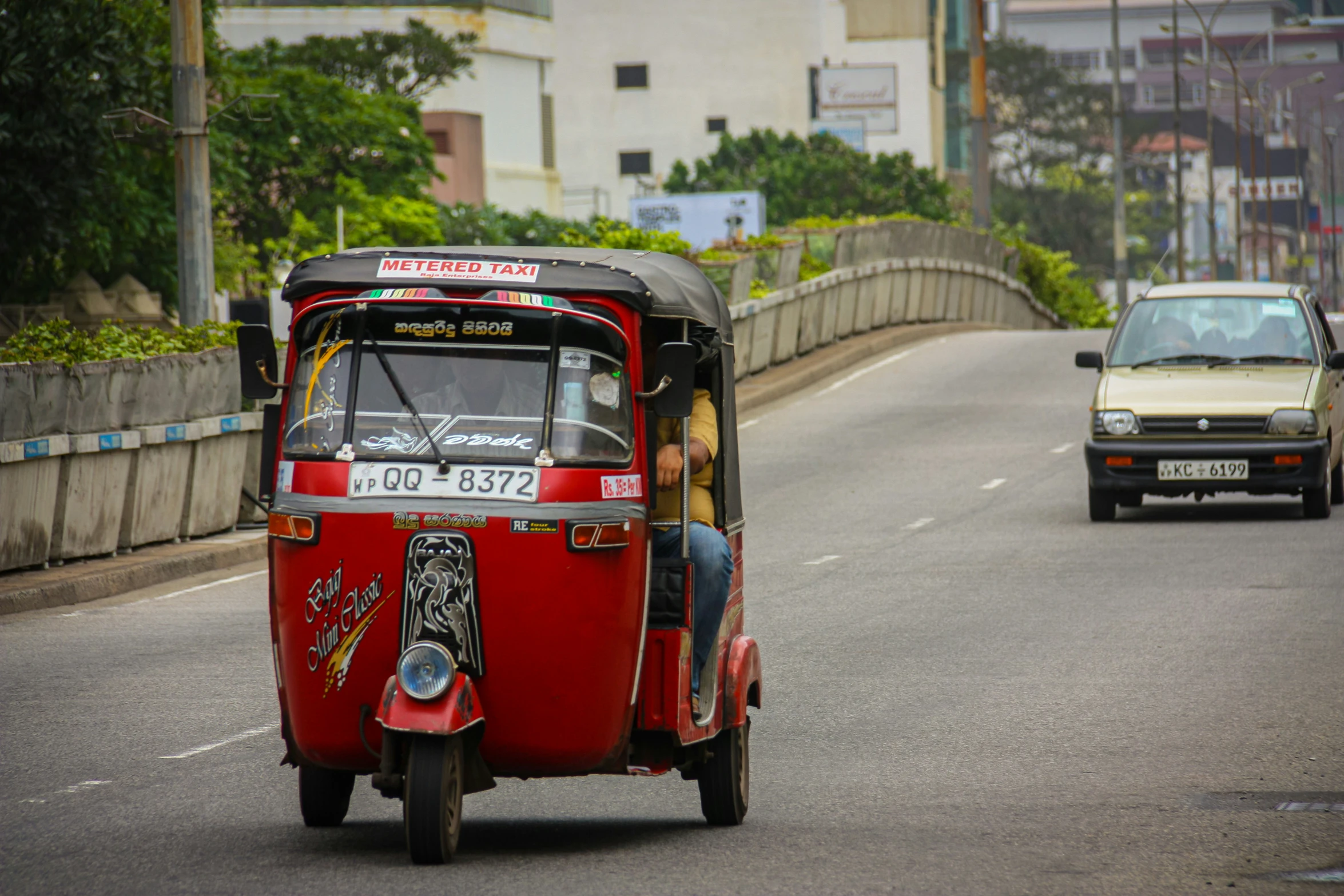 the passenger tuk - tuks are also used by local people