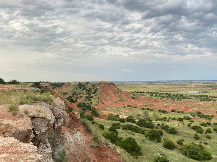 a cliff with grass and dirt on each side