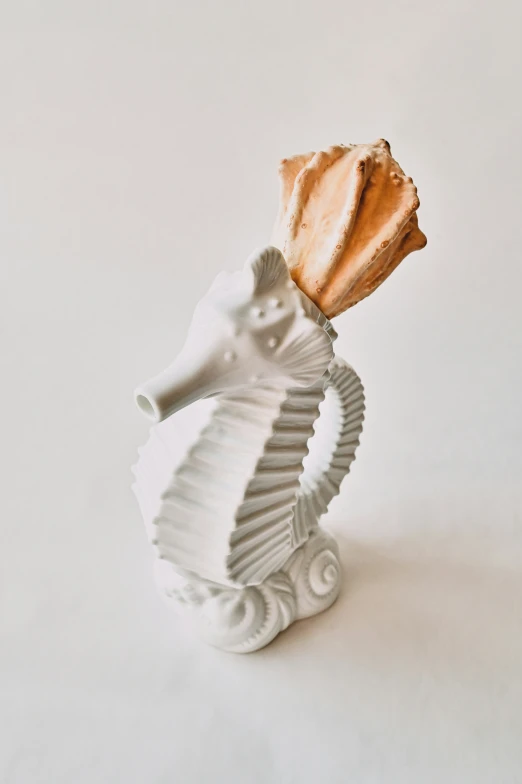 a ceramic sea horse head, on a white background