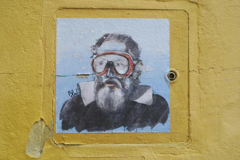 a street sign showing a man in a mask and goggles