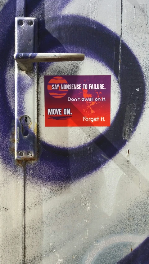 an artistically painted door with the words say nonsense to failure and move on