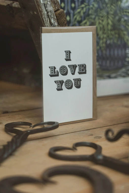 a piece of paper with a picture inside that says i love you