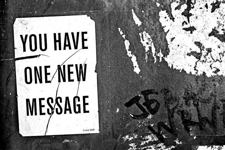 a sign saying you have one new message on the wall