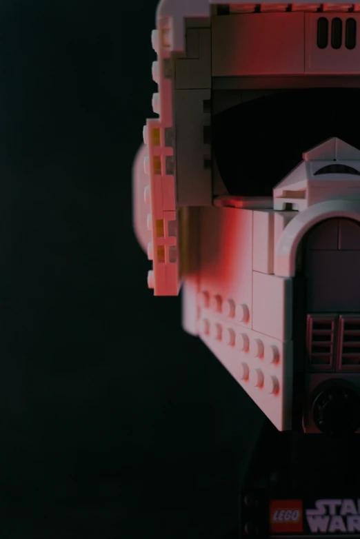 a toy's head and a star wars logo are shown in front of the lego lights