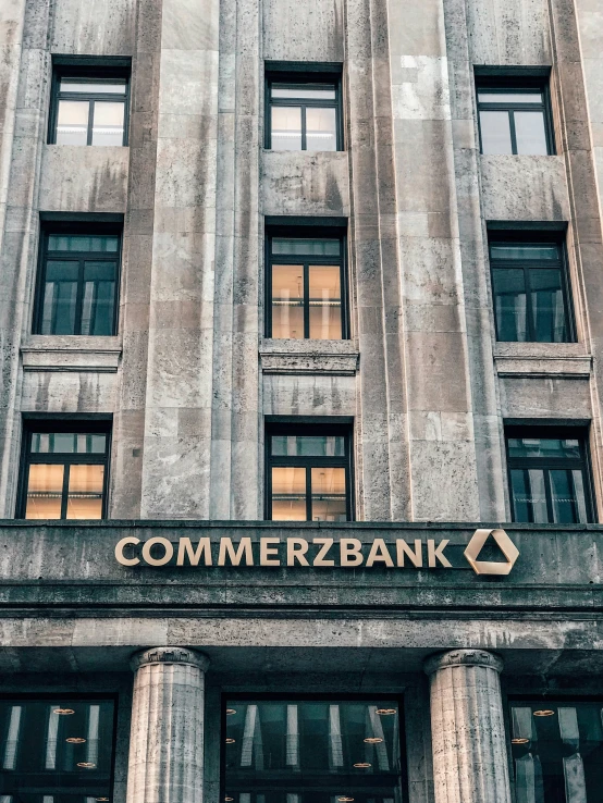 the entrance to an old commercial bank building