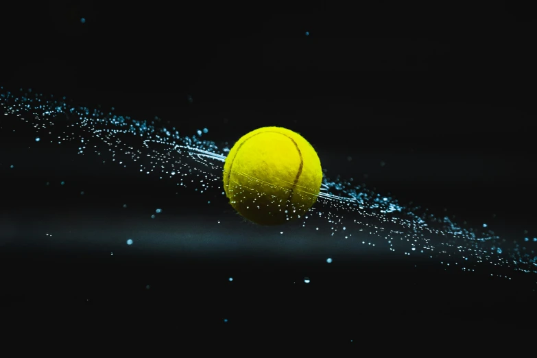 a tennis ball is hitting and rolling down the court