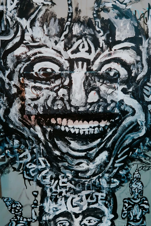 a painting of a face with mouth and eyes