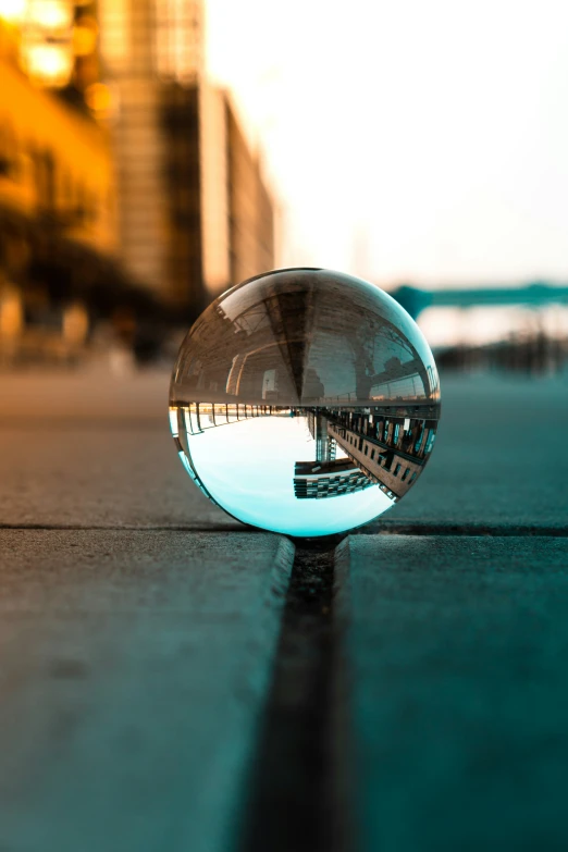 a very cute little crystal ball laying on the ground