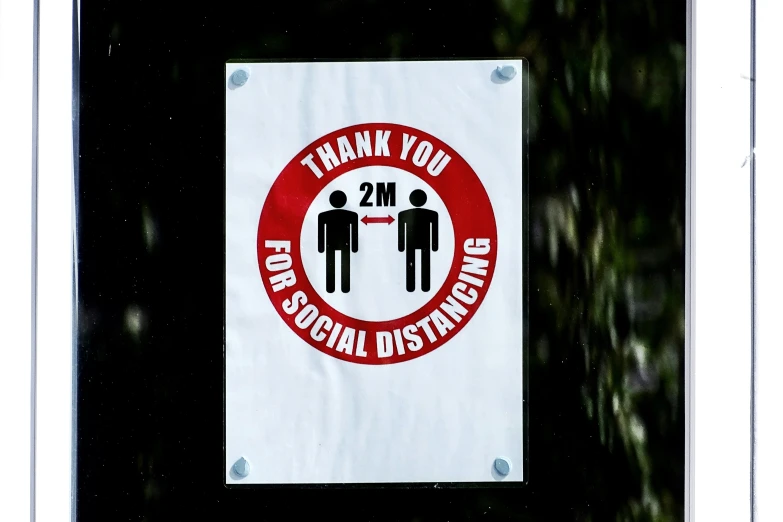 a sign that says thank you for social distantion