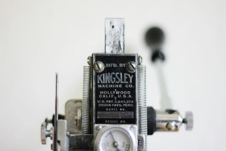 a clock made from mechanical parts and a key