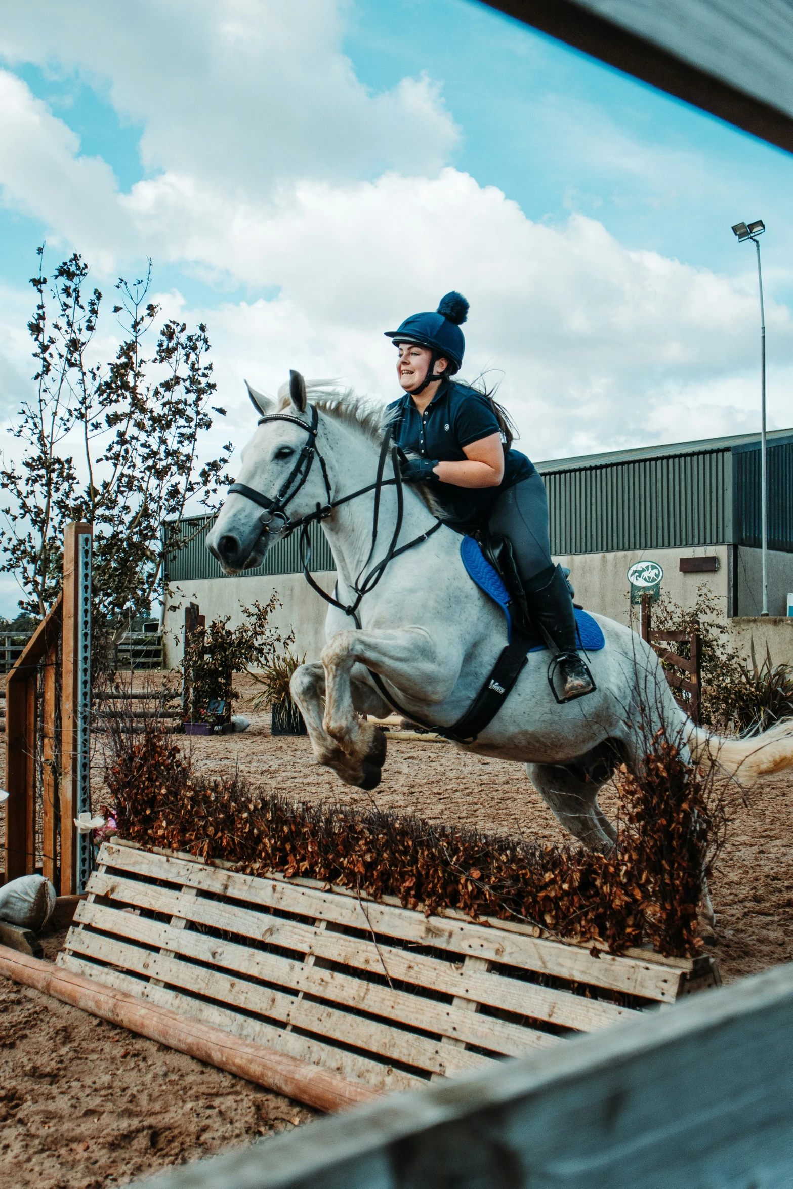 a person riding on the back of a white horse