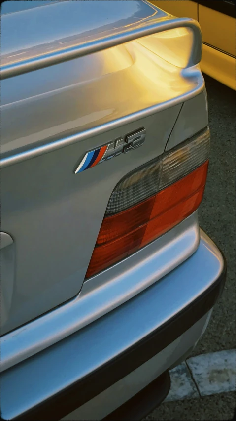 a close up po of the emblem on a silver bmw car