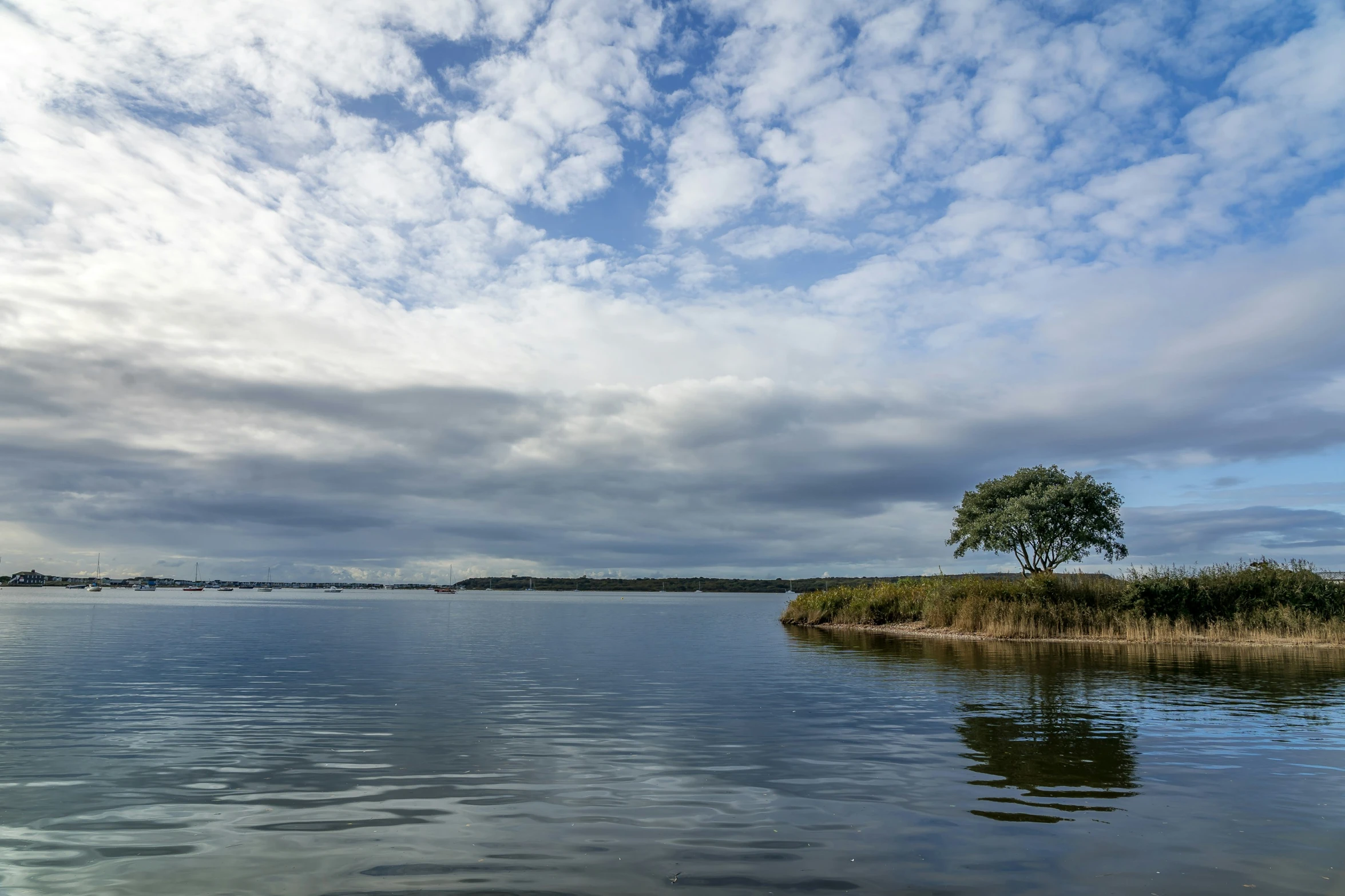 this is an image of clouds in the sky over the water