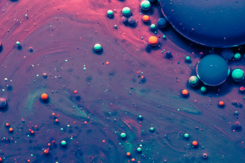 colorful bubbles that are mixed in with water