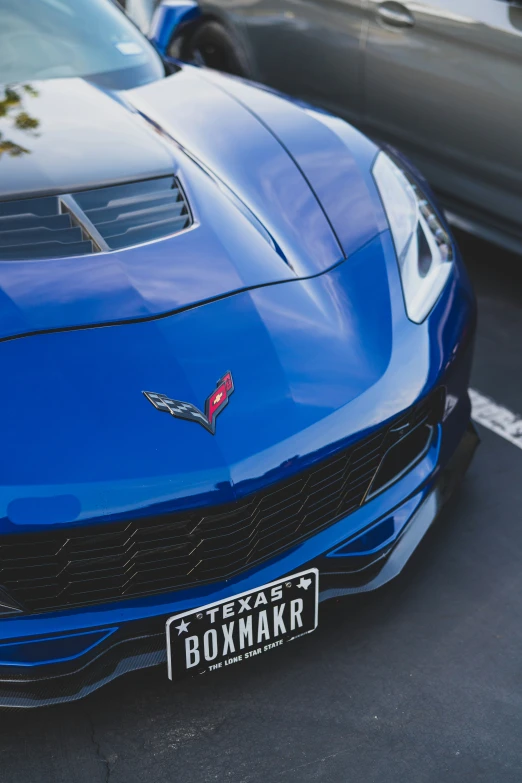 the rear end of a very nice blue chevrolet camaro