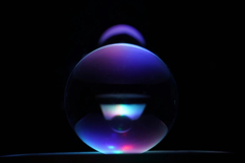 a colorful sphere with a dark background