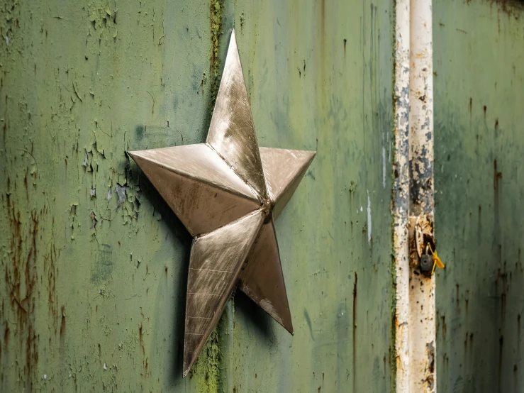 a star is mounted on an old building