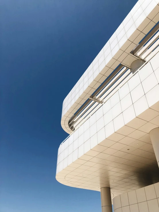 white buildings with metal railings against a blue sky