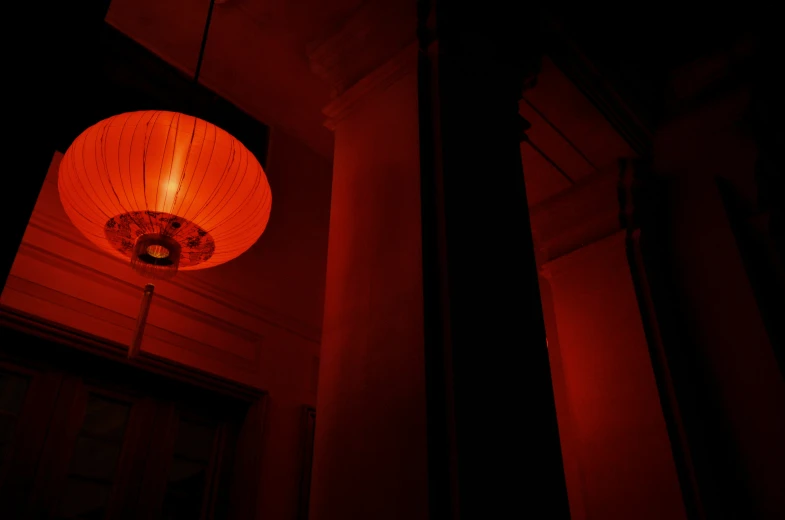 a close up of a lit lantern outside of a building