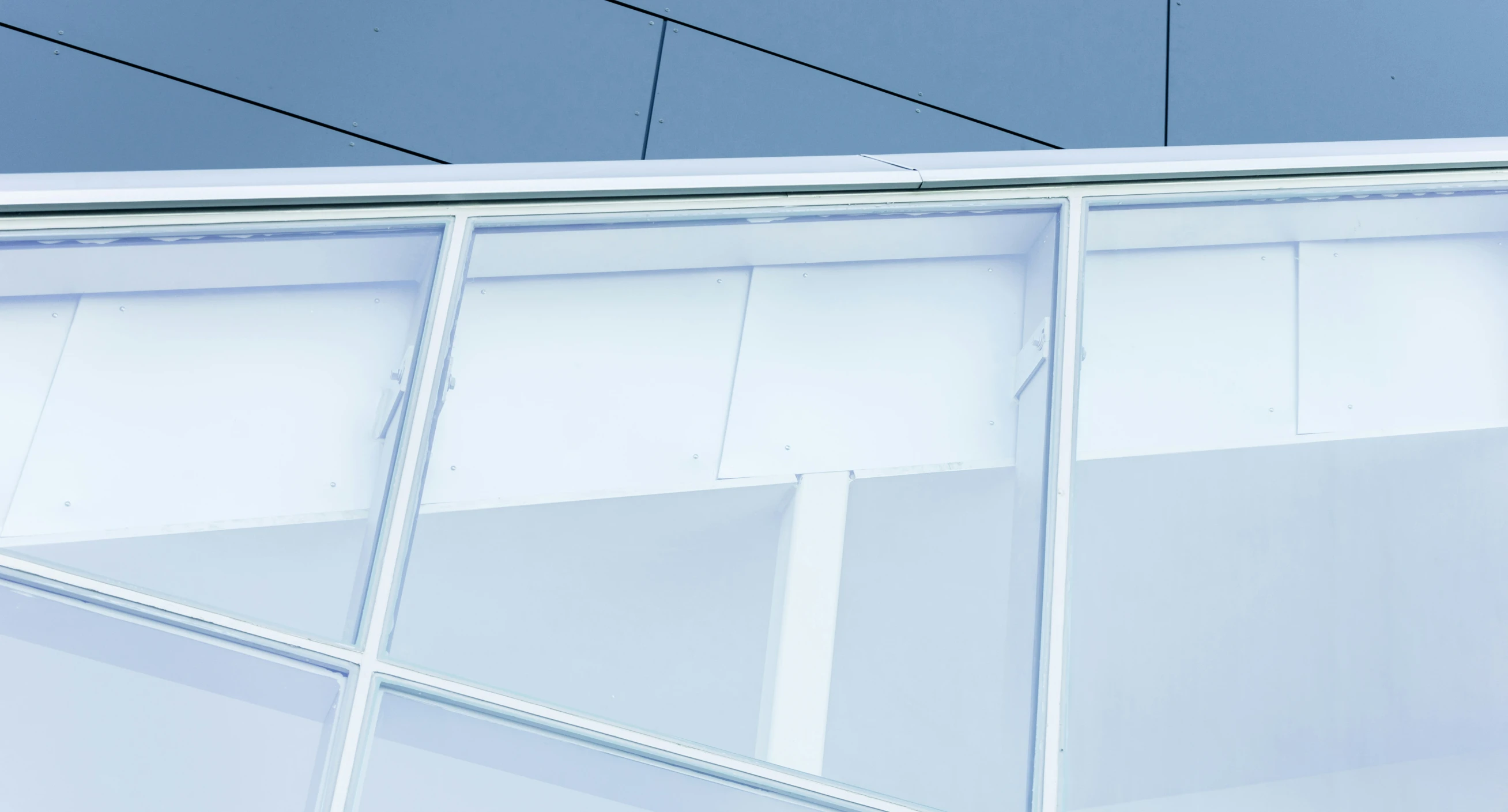 closeup of the corner and glass walls of a building