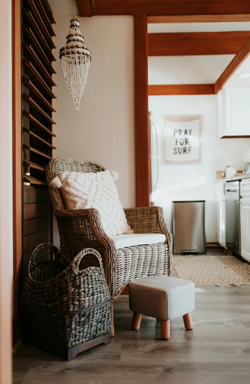 wicker chair next to foot stool in kitchen