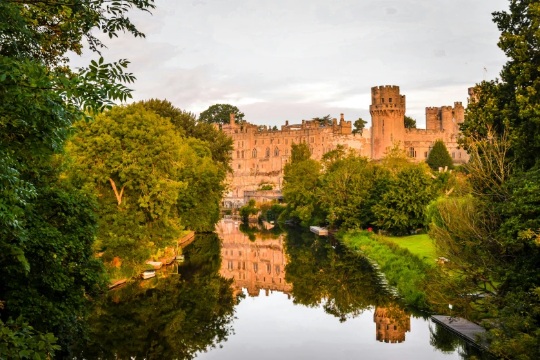 a castle surrounded by trees and water