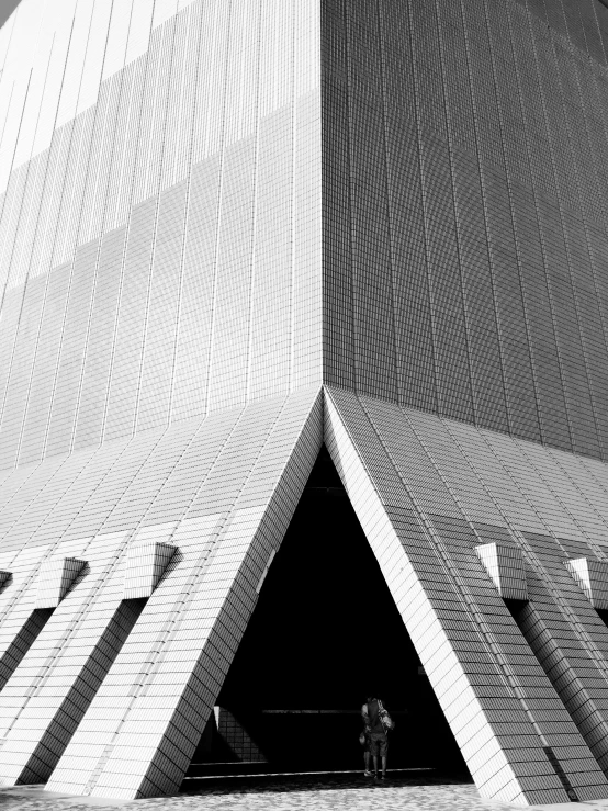 a black and white po of a large triangular building