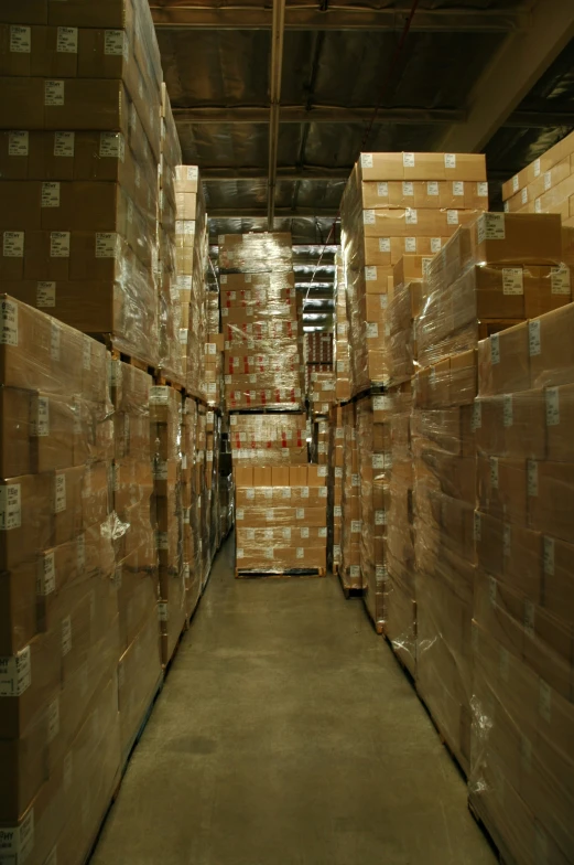 boxes are sitting on wooden shelves in a warehouse