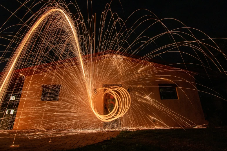 light spinning in the dark sky at night