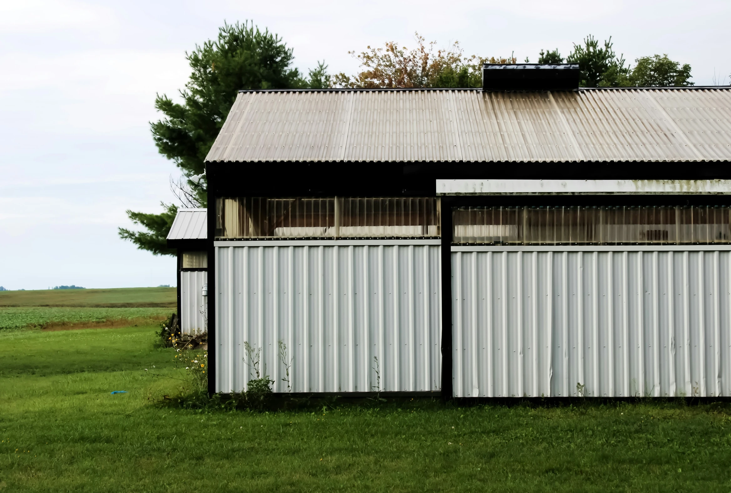 a po of the front of a building in the field