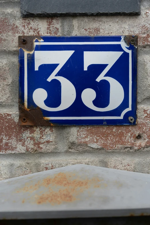 a number plate on the side of a building