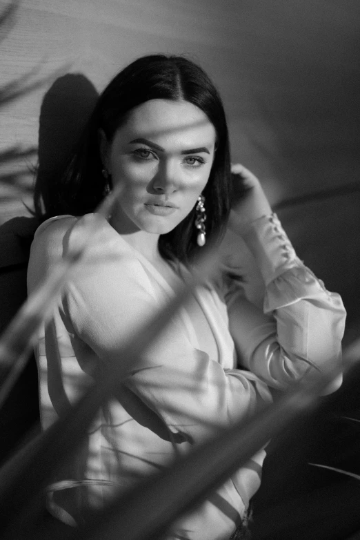 woman smiling and standing in black and white image